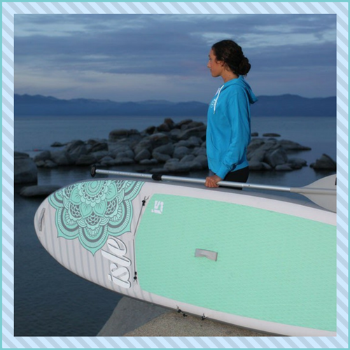 Isle inflatable paddle board with young lady